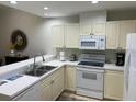 Well-equipped kitchen featuring ample cabinetry and modern appliances at 3604 54Th W Dr # 103, Bradenton, FL 34210