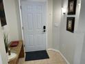 Bright and airy entryway with tile flooring and neutral color scheme at 3604 54Th W Dr # 103, Bradenton, FL 34210