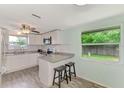 Renovated kitchen with granite counters and breakfast bar at 2900 Siesta Dr, Venice, FL 34293