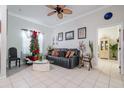 Bright living room showcasing a cozy seating area and hardwood floors at 342 Wyler St, Port Charlotte, FL 33954