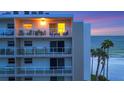 Oceanfront building with multiple balconies and stunning sunset views at 2721 Gulf Of Mexico Dr # 607, Longboat Key, FL 34228