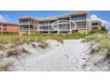 Condo with beautiful beach views, screened patios, and multiple levels at 1900 Gulf N Dr # 4, Bradenton Beach, FL 34217