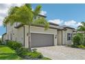 Two-story home features a gorgeous gray tile roof and manicured landscaping at 5713 Cheech Gln, Lakewood Ranch, FL 34211