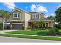 Two-story home with landscaping and a two-car garage at 4618 Arbor Gate Dr, Bradenton, FL 34203