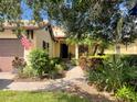 Inviting home exterior showcasing a well-manicured lawn and vibrant landscaping at 924 Preservation St, Bradenton, FL 34208