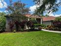House exterior with manicured lawn and landscaping at 22105 Deer Pointe Xing, Bradenton, FL 34202