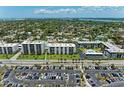 Aerial view of beachfront condominium complex and parking lot at 797 Beach Rd # 509, Sarasota, FL 34242