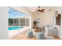 Bright Gathering room with light flooring and pool view at 5897 Carriage Dr, Sarasota, FL 34243