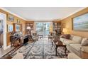 Elegant living room with ornate rug and built-in bookshelves at 101 S Gulfstream Ave # 4A, Sarasota, FL 34236