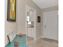 Bright hallway with laundry area at 11624 Garessio Ln, Sarasota, FL 34238