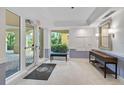 Building lobby with seating, mailboxes, and access to the outdoors at 409 N Point Rd # 502, Osprey, FL 34229