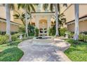 Elegant courtyard entrance with a fountain at 409 N Point Rd # 502, Osprey, FL 34229
