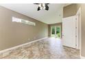 Bedroom with tile floors, neutral walls and access to backyard at 337 Snapdragon Loop, Bradenton, FL 34212