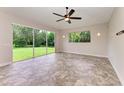 Gathering room with sliding doors to backyard and tile floors at 337 Snapdragon Loop, Bradenton, FL 34212