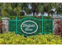 Sheffield Glenn community entrance with a green metal gate and stone pillars at 7407 64Th E St, Palmetto, FL 34221