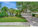 Landscaped one story home with a two car garage at 6122 44Th E Ct, Bradenton, FL 34203