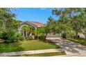 One story home with a two car garage and lush landscaping at 6122 44Th E Ct, Bradenton, FL 34203