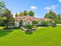 One story home with tile roof, lush landscaping at 6196 9Th Avenue Ne Cir, Bradenton, FL 34212