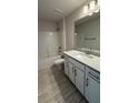 Bathroom with a bathtub, shower, vanity, and tile floors at 2620 Averland Loop, North Port, FL 34287