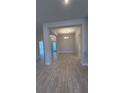 Bright dining room with wood-look tile floors and a chandelier at 2620 Averland Loop, North Port, FL 34287