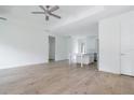 Open concept living room with kitchen island and hardwood floors at 14390 Maddock Ave, Port Charlotte, FL 33953