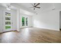 Spacious living room with hardwood flooring and ceiling fan at 14390 Maddock Ave, Port Charlotte, FL 33953