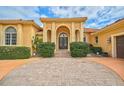 Elegant home with double doors and circular driveway at 909 Macewen Dr, Osprey, FL 34229