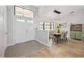 Bright dining area with light wood floors and hutch at 4260 Cape Haze Dr, Placida, FL 33946