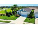 Single-Gathering home with gray siding and a two-car garage in a residential neighborhood at 3444 Bitterroot Ln, Lakewood Ranch, FL 34211