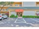 Condo building entrance with parking at 8630 Midnight Pass Rd # 103A, Sarasota, FL 34242