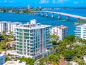Luxury high-rise condo with floor-to-ceiling windows offering breathtaking views of the Intracoastal Waterway and surrounding area at 111 Golden Gate Pt # 201, Sarasota, FL 34236