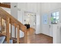 Bright entryway with wood stairs and view into an office at 3125 57Th Avenue E Cir, Bradenton, FL 34203