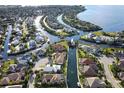 Gorgeous aerial view of waterfront neighborhood featuring boat docks and lush tropical landscaping at 4532 Shark Dr, Bradenton, FL 34208