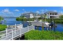 A well-maintained private boat dock on a sunny day, ready for waterfront living and adventures at 4607 5Th Ne Ave, Bradenton, FL 34208