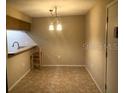 Small dining area with breakfast bar and tiled floor at 3271 Beneva Rd # 204, Sarasota, FL 34232