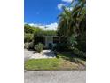 Quaint beach cottage showcasing a welcoming front entrance and landscaping at 1603 Gulf N Dr # 5, Bradenton Beach, FL 34217