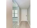 Bright condo entryway with white door and wood-look floors at 515 30Th W Ave # H201, Bradenton, FL 34205