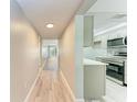 Hallway view of condo with kitchen and living area at 515 30Th W Ave # H201, Bradenton, FL 34205