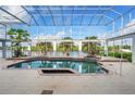 Enclosed pool and spa with a view of the waterway at 4323 Rock Creek Dr, Port Charlotte, FL 33948