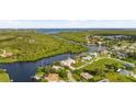 Bird's eye view of waterfront property and surrounding homes at 4323 Rock Creek Dr, Port Charlotte, FL 33948