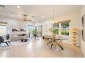 Open concept dining area with modern table and chairs at 4405 Lenox Blvd, Venice, FL 34293