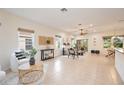 Open living room with tile floors and neutral decor at 4405 Lenox Blvd, Venice, FL 34293