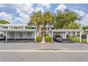 Carport parking with walkways and landscaping at 429 Cerromar Ln # 353, Venice, FL 34293