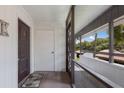 Condo entryway with private door and screened-in porch at 3500 El Conquistador Pkwy # 238, Bradenton, FL 34210