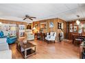 Spacious living room with wood-look floors and ample seating at 3410 Spanish Oak Ter, Sarasota, FL 34237