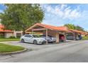 Open parking area with covered spaces to protect vehicles from weather at 6384 Draw Ln # 38, Sarasota, FL 34238