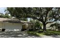 Single Gathering home exterior with attached garage at 3925 Oakhurst Blvd # 3010, Sarasota, FL 34233