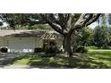 Single Gathering home exterior with attached garage at 3925 Oakhurst Blvd # 3010, Sarasota, FL 34233