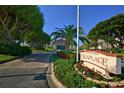 A beautiful sign for Seaplace is surrounded by trees, flowers, and manicured landscaping at 1945 Gulf Of Mexico Dr # M2-310, Longboat Key, FL 34228