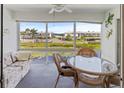 Bright lanai with water views, seating, and a table at 4819 Independence Dr # 4819, Bradenton, FL 34210